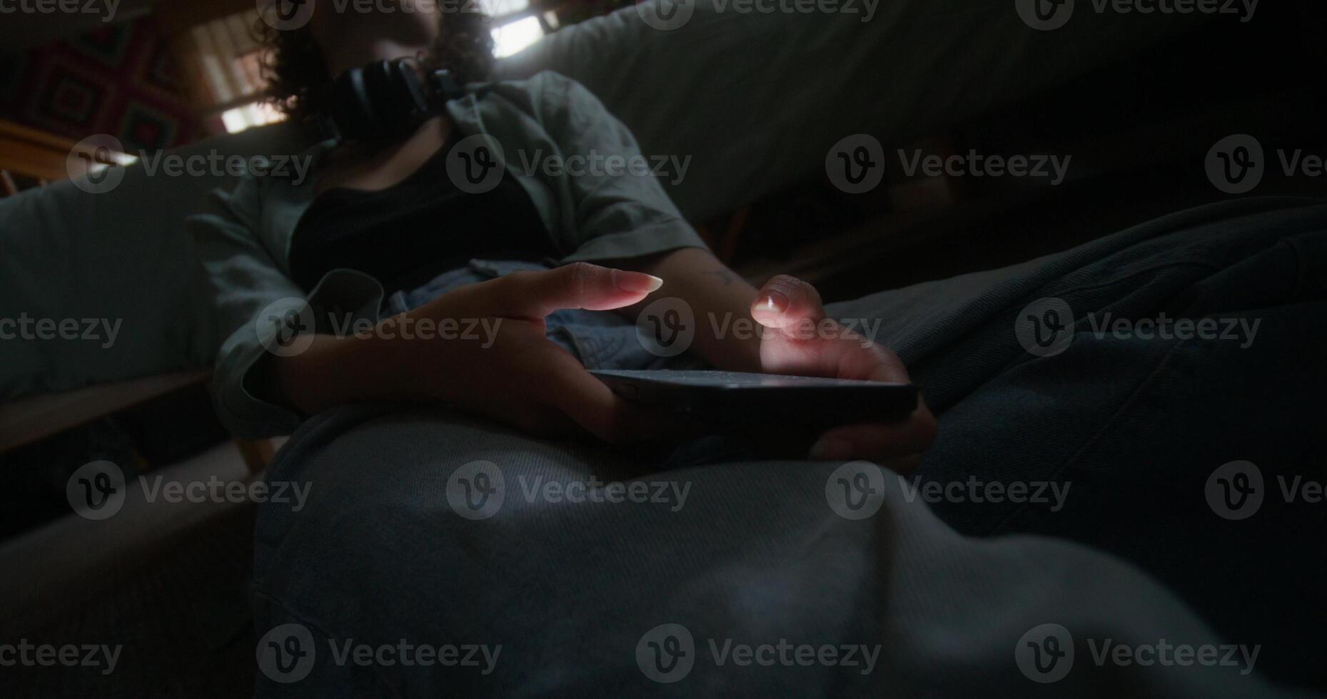 A person laying on the floor with a cell phone photo