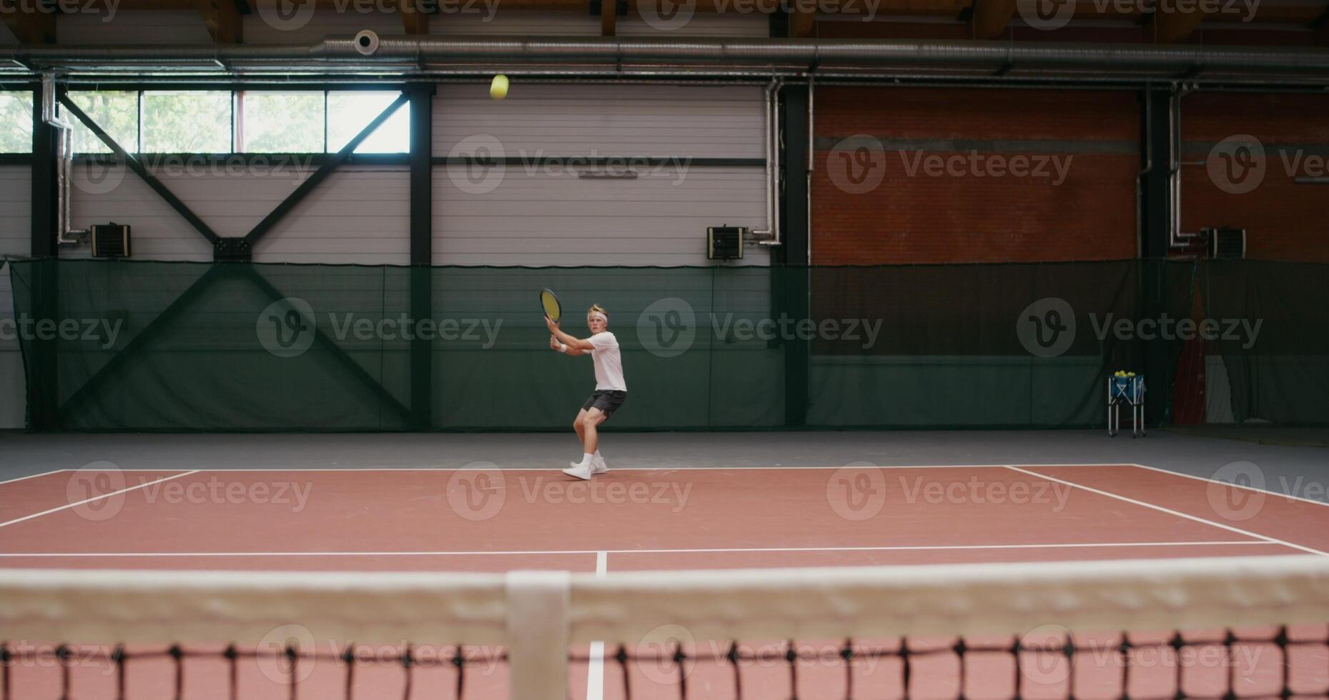 A male tenessist hits the last ball and wins the round photo