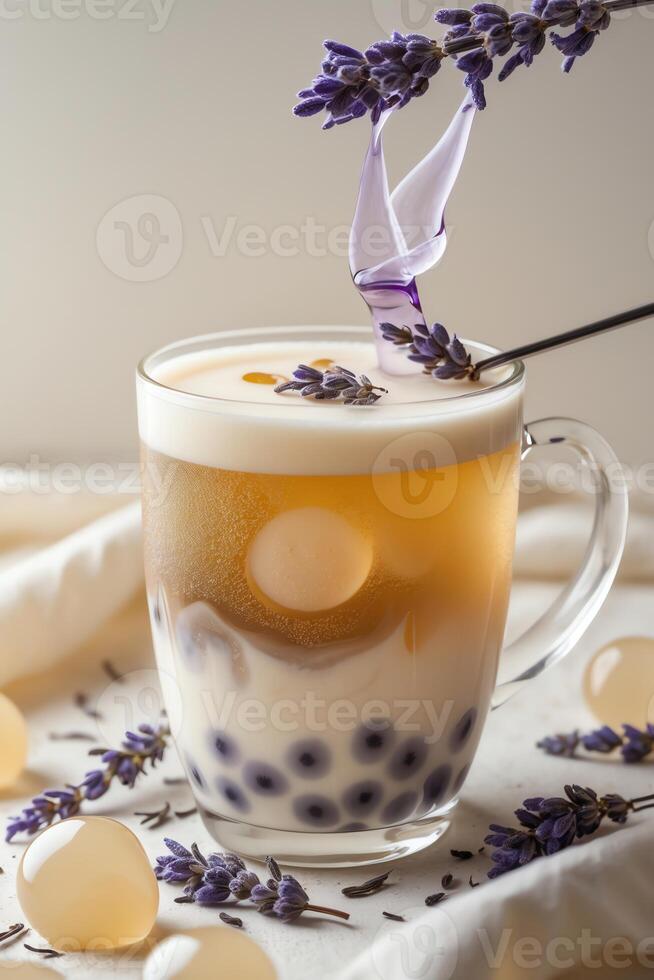 A beautifully layered drink featuring lavender, milk, and tapioca pearls in a clear glass. photo