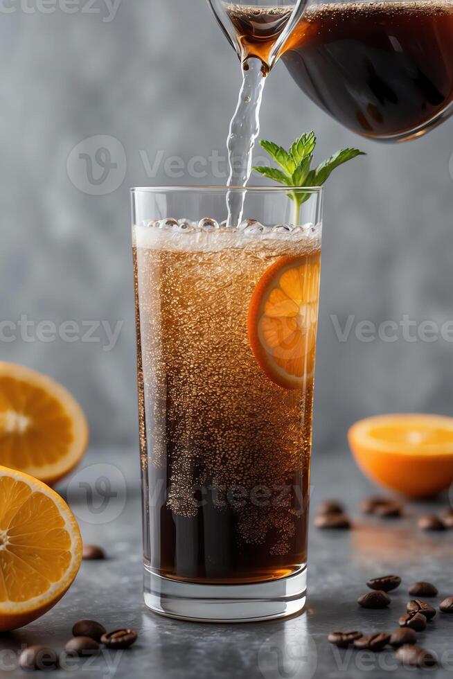 A refreshing drink with bubbles, garnished with an orange slice and mint, served in a tall glass. photo