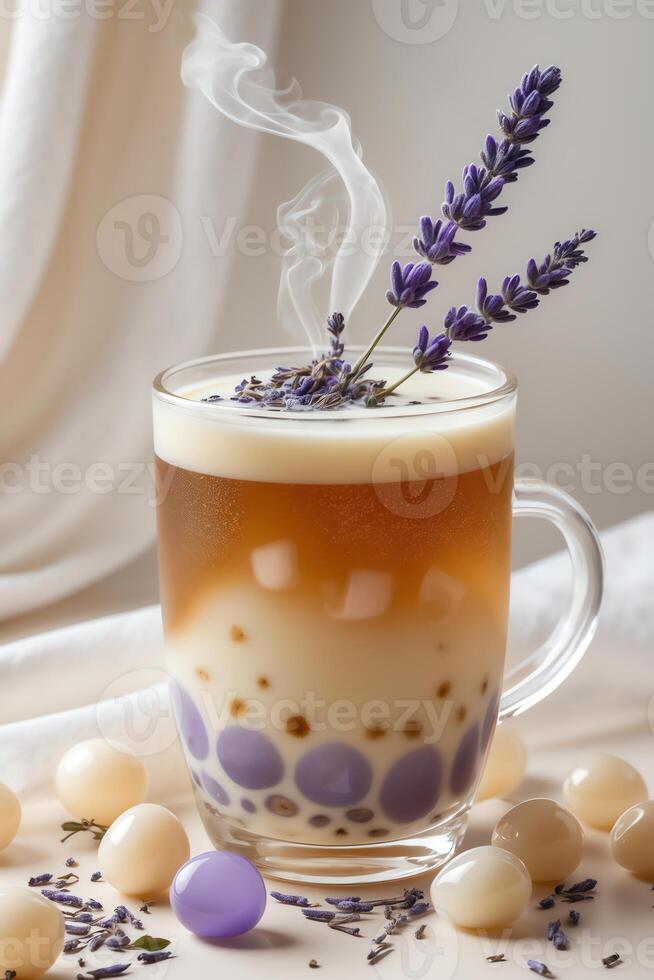 A steaming beverage topped with lavender and colorful bubbles in a glass cup. photo