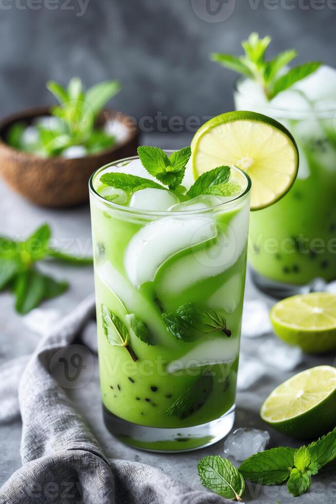 Refreshing green drink with mint and lime, perfect for a hot day. photo