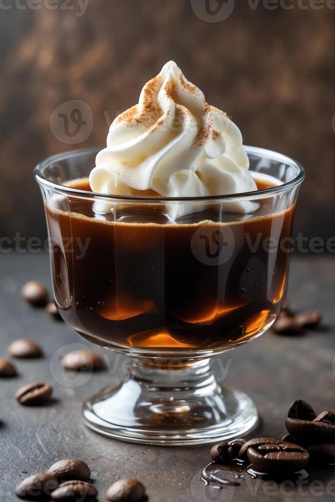 A glass of coffee topped with whipped cream and sprinkled with cinnamon, surrounded by coffee beans. photo
