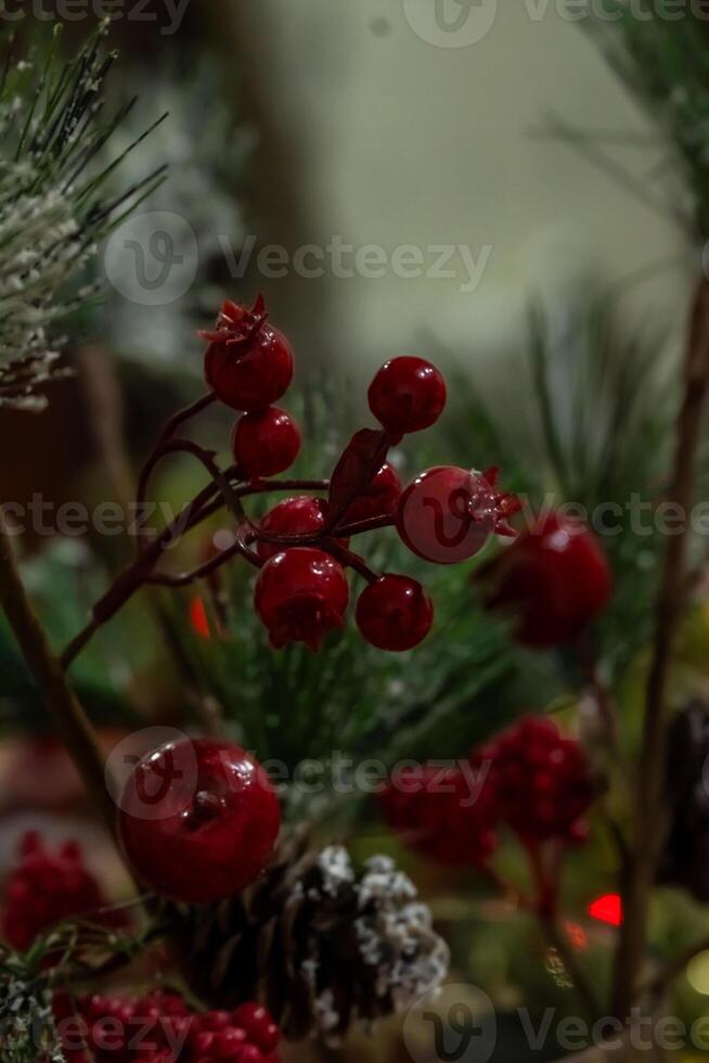Christmas decorations with red berries and pine cones photo