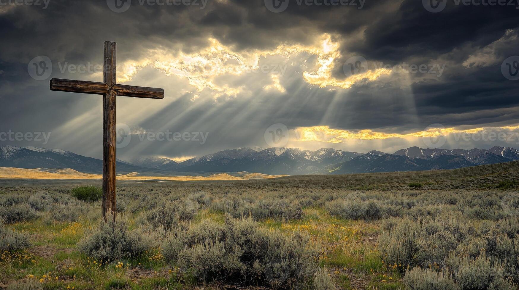 Wooden cross in mountain landscape under dramatic sky photo