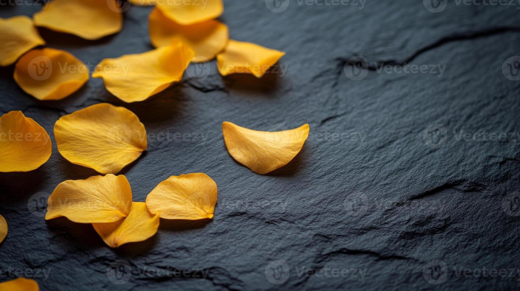 Minimalist composition with golden petals on textured surface for artistic decor.Vishu day photo