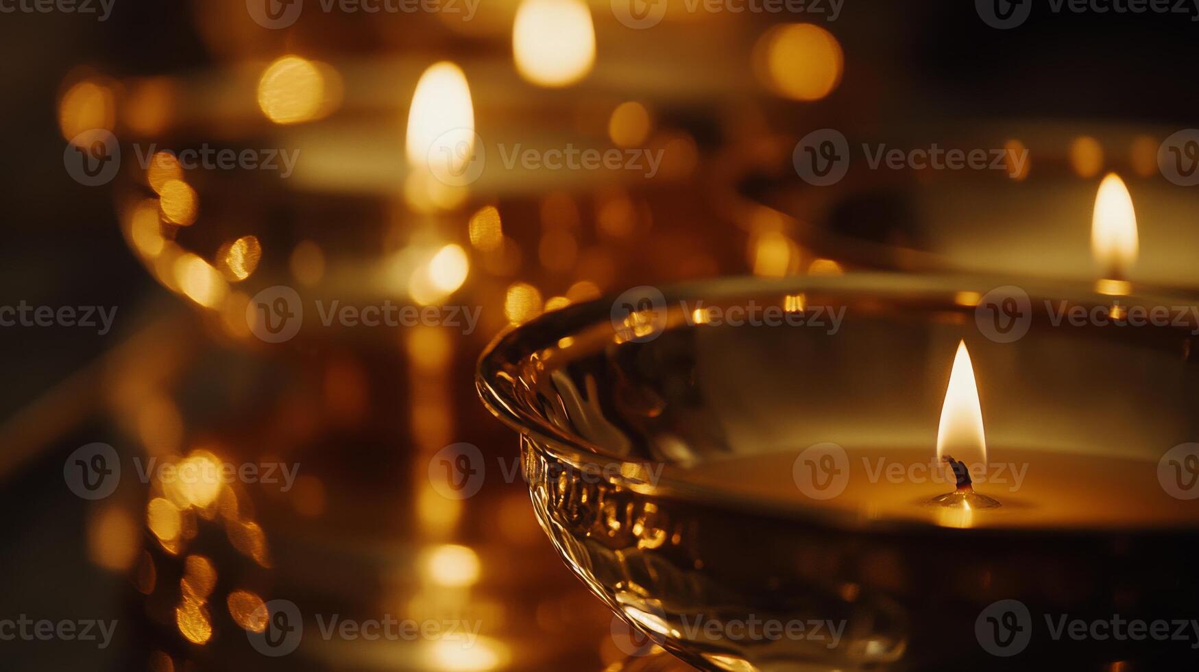 Traditional kerala brass lamps with flickering flames - close up macro.Vishu day photo