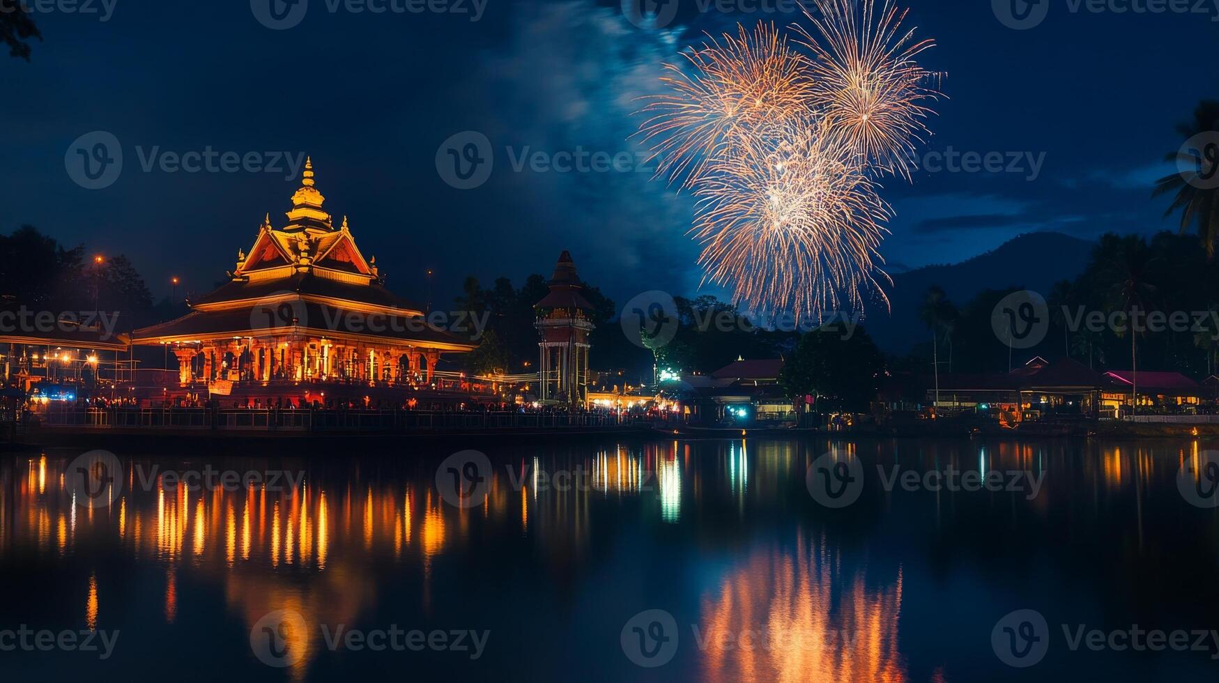 Traditional vishu fireworks illuminate night sky over temple reflections.Vishu day photo