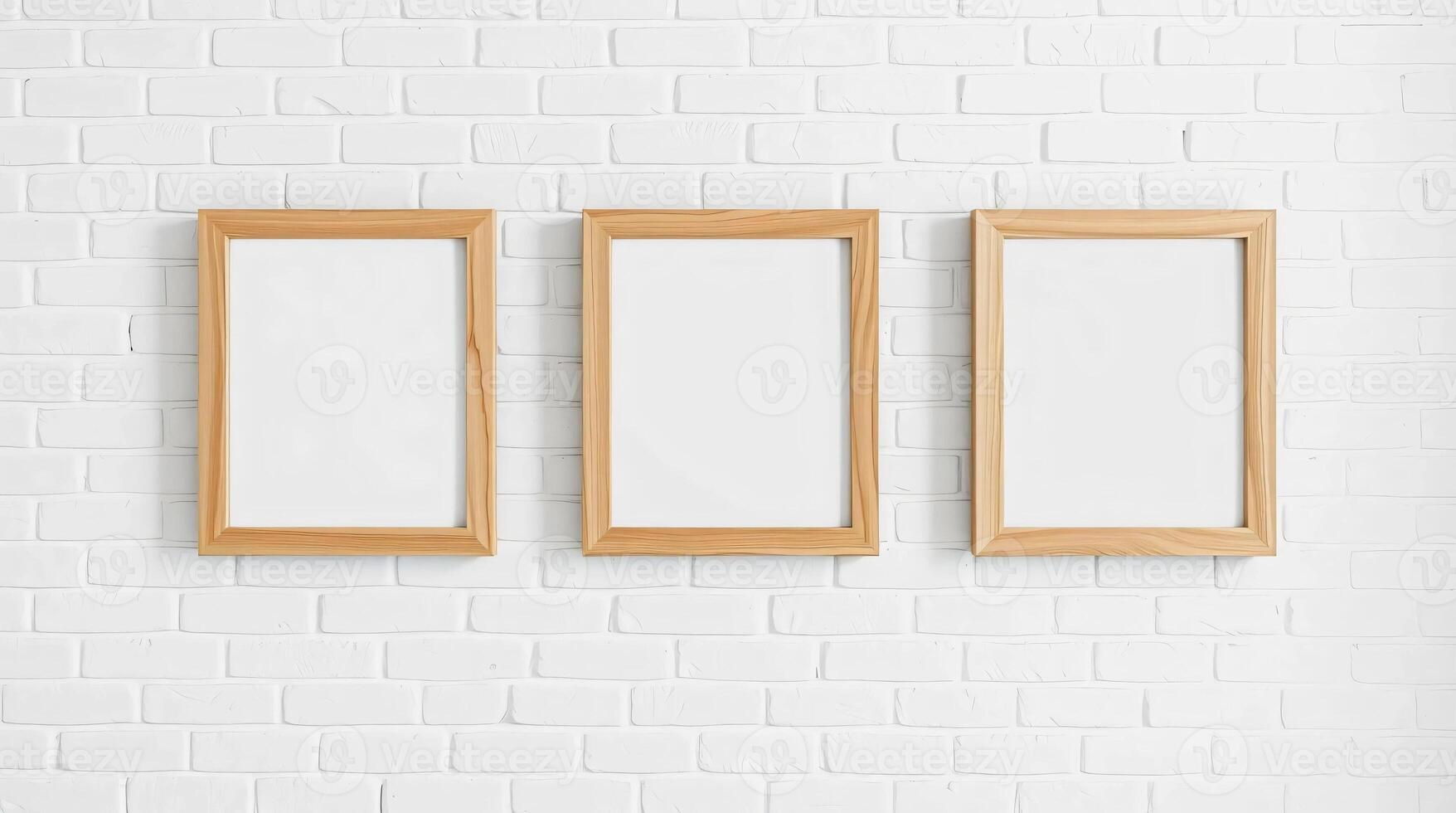 Three empty wooden frames hanging on a white brick wall photo