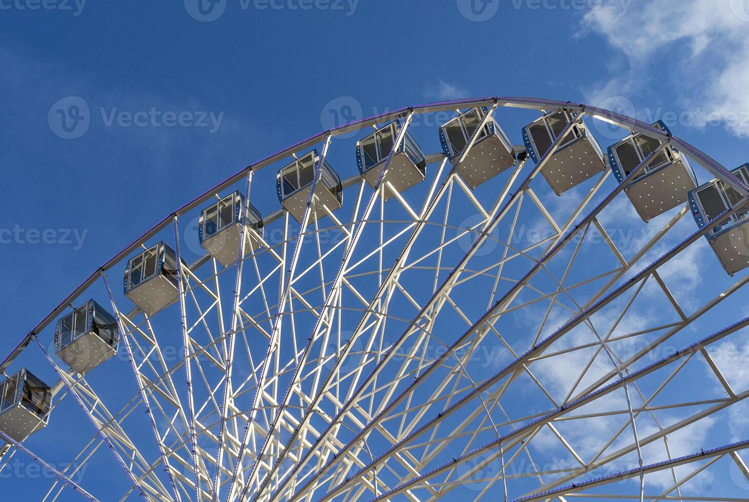 Ferris wheel on a background of blue sky photo