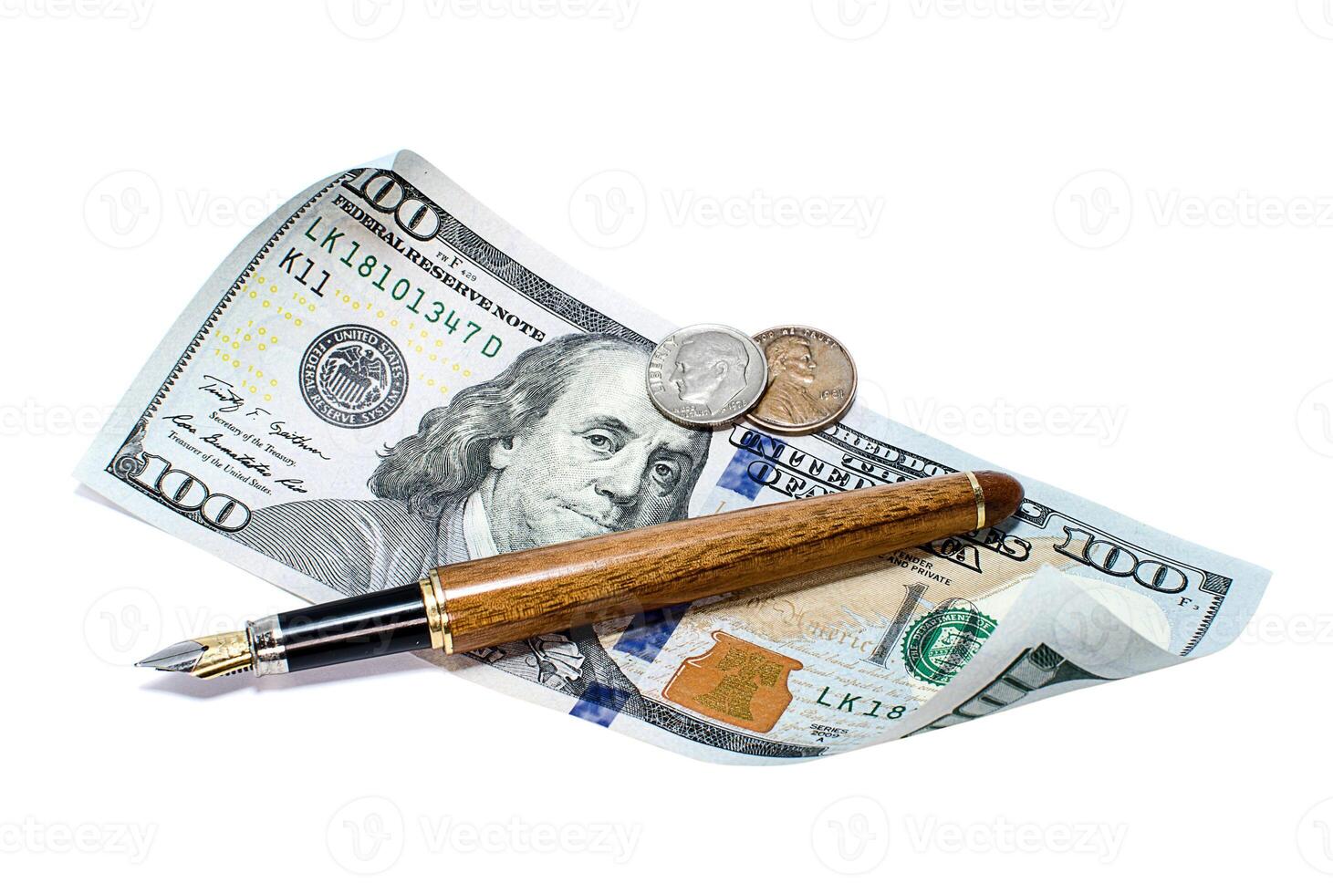 Twisted banknote of one hundred dollars, coins and pen on a white background photo