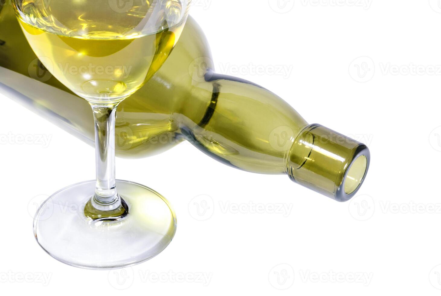 Green glass bottle and wineglass of dry wine photo