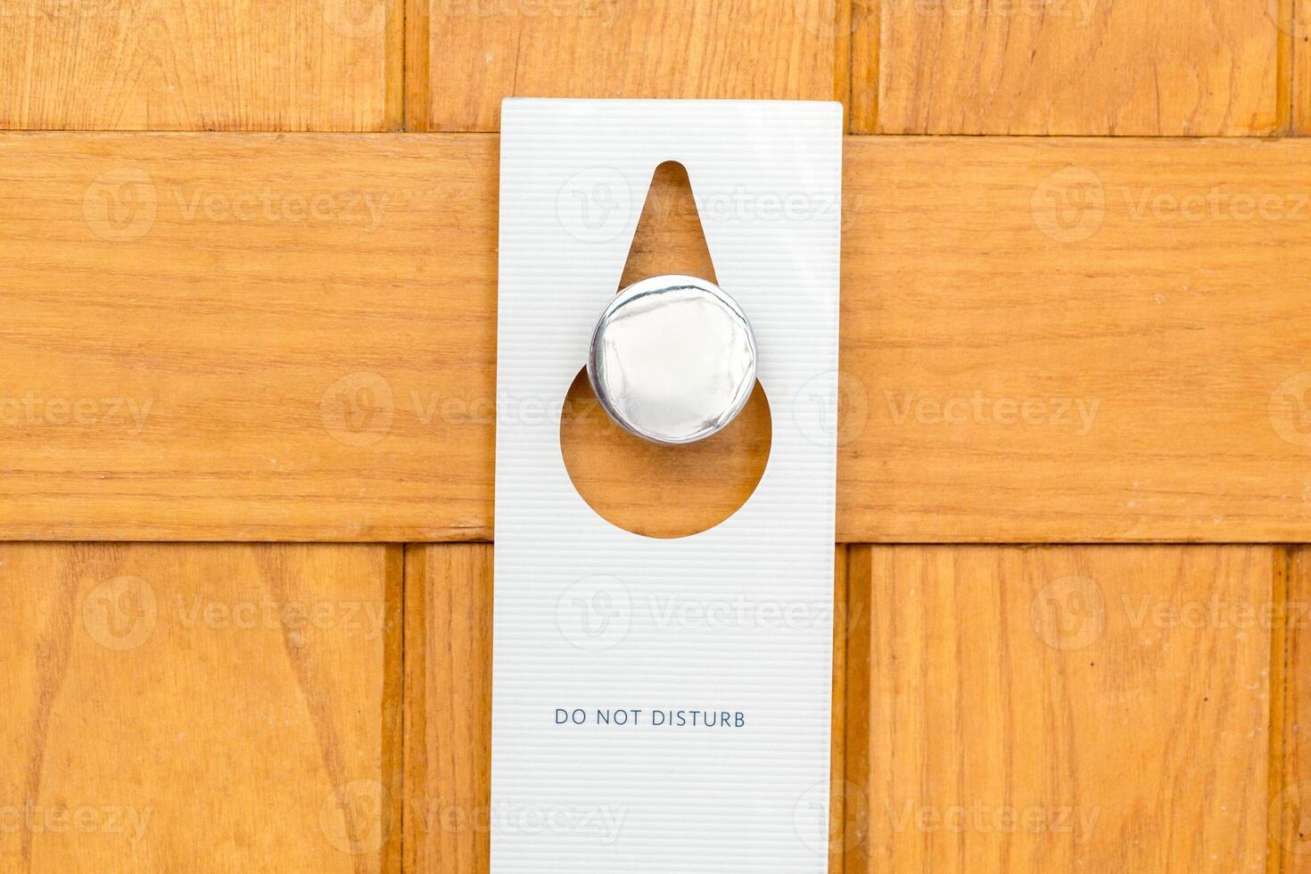 please do not disturb sign on Closed wooden door hotel room photo