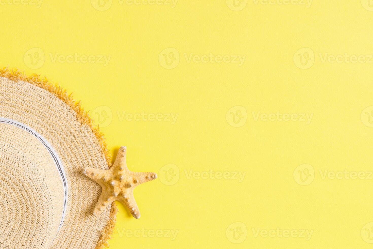 yellow retro straw with seastar top view with copy space. summer concept on yellow background photo