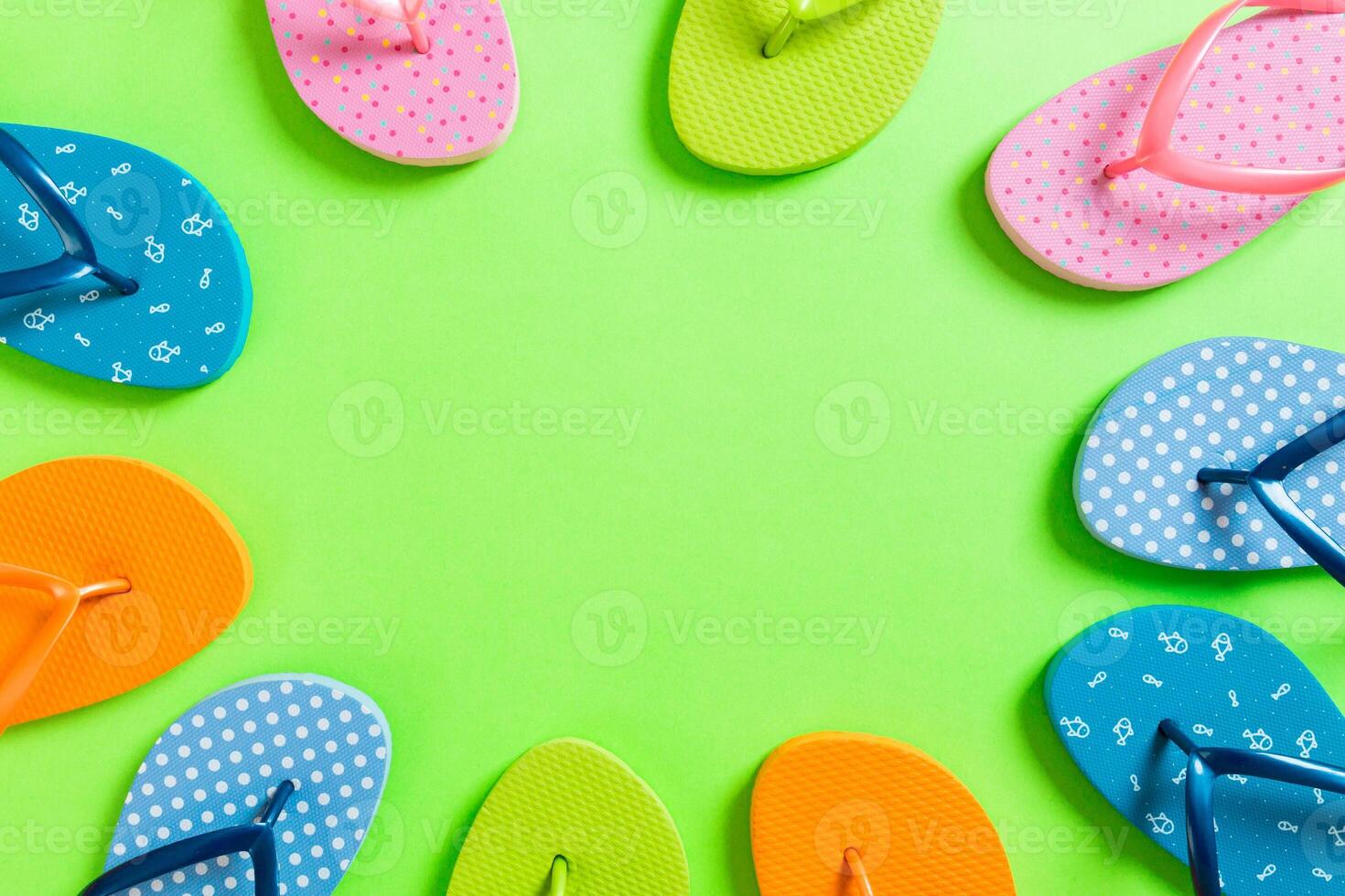 a lot of flip flop colored sandals, summer vacation colored background, copy space top view photo