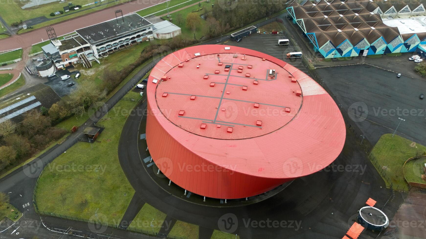 Aerial View of Modern Red Circular Zenith Arena with Unique Architectural Design photo
