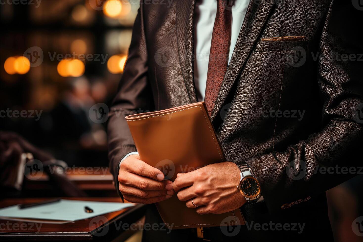 Diary or a folder with documents in the hands of a businessman in close-up photo