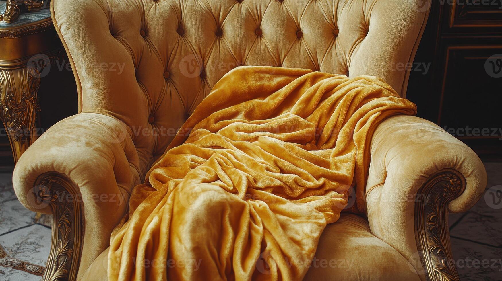 Luxurious golden velvet blanket on antique armchair photo