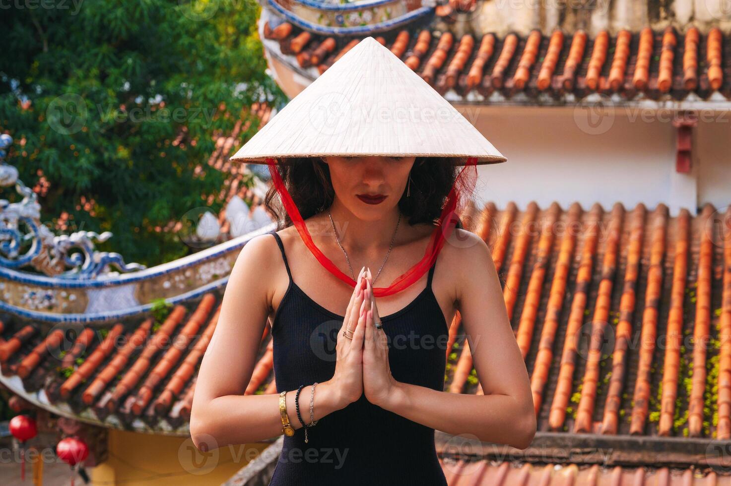 portrait of a woman tourist traveler at the temple on Buddhist pagoda in Vietnam. Travel and tourism in Asia photo