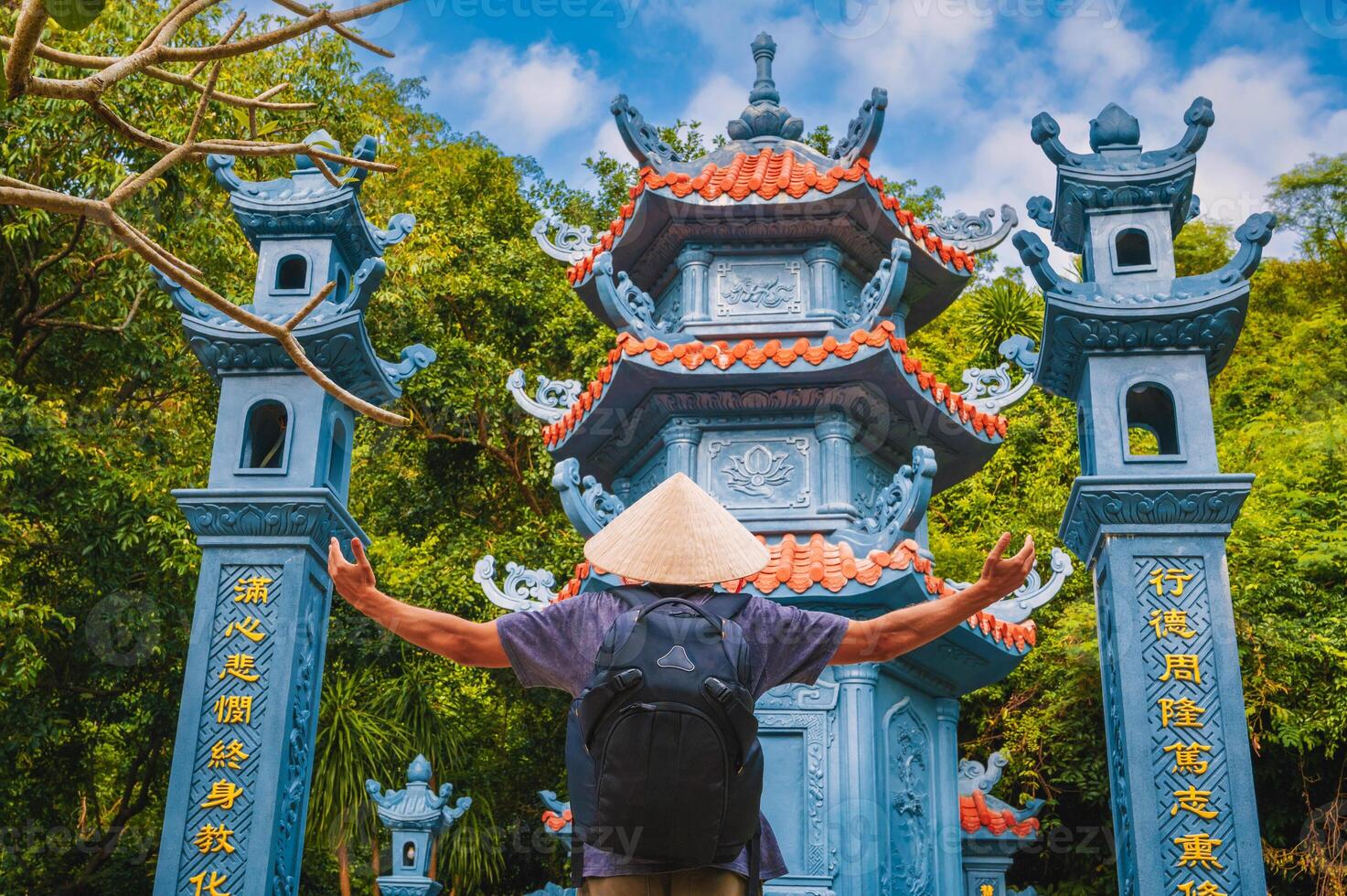 back of a man tourist traveler at temple on Buddhist pagoda in Da Nang, Vietnam. Travel and tourism in Asia photo