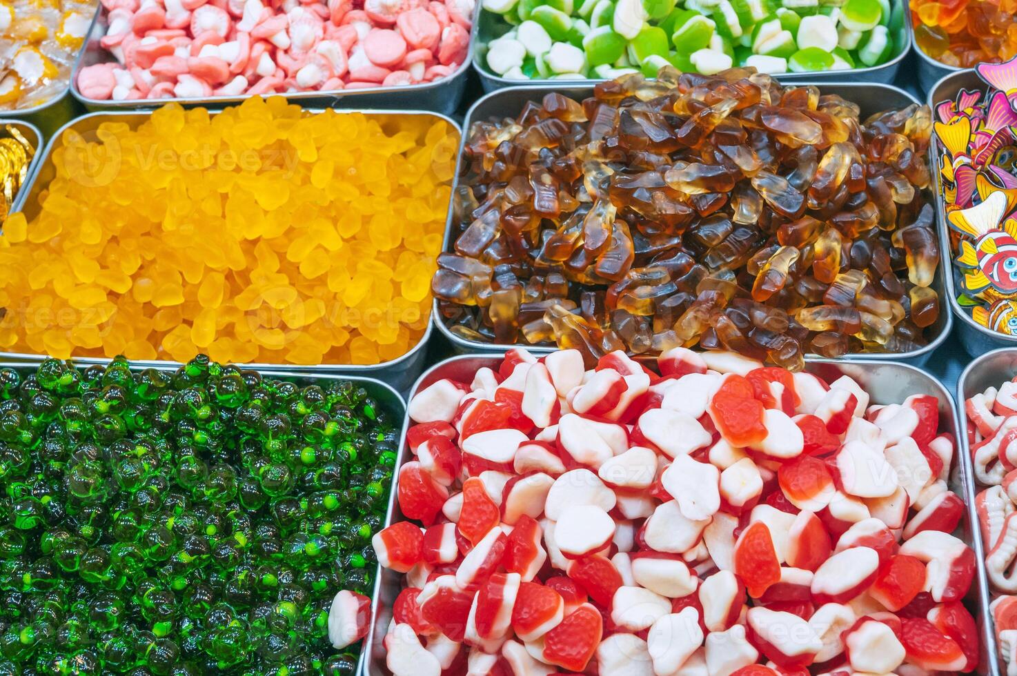 colorful marmalade and chewable candies on counter at a candy store in oriental market in Asia photo