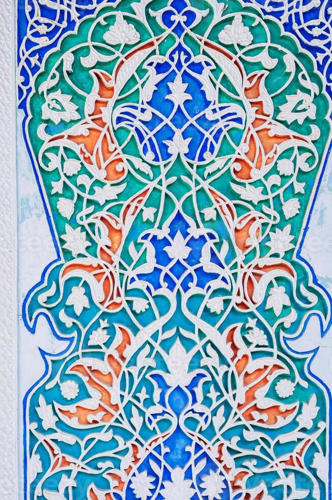 wooden painted background in Museum of Art of Uzbekistan with traditional Uzbek ornaments and oriental patterns photo