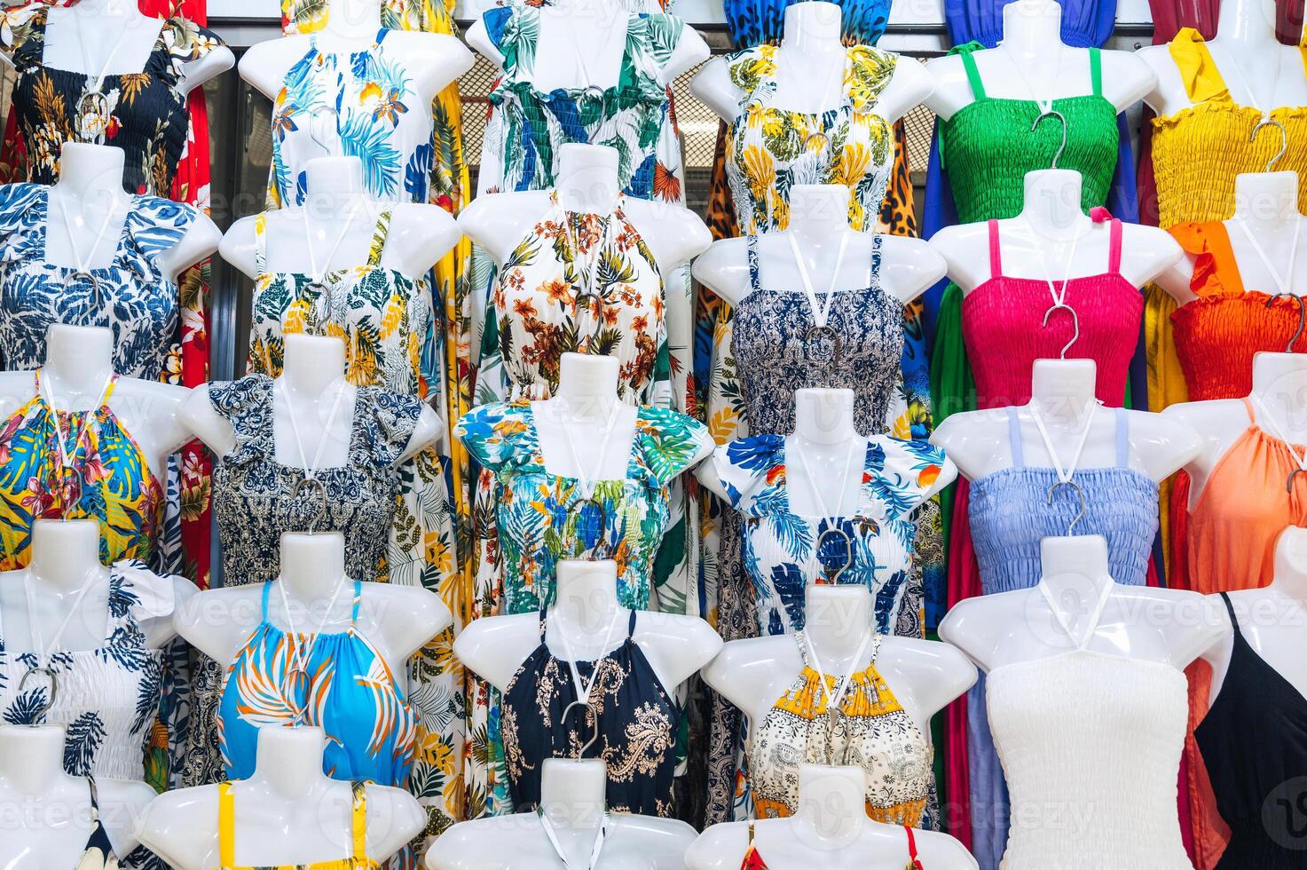 female summer dresses on mannequins on market bazaar in Asia textile clothes shop photo