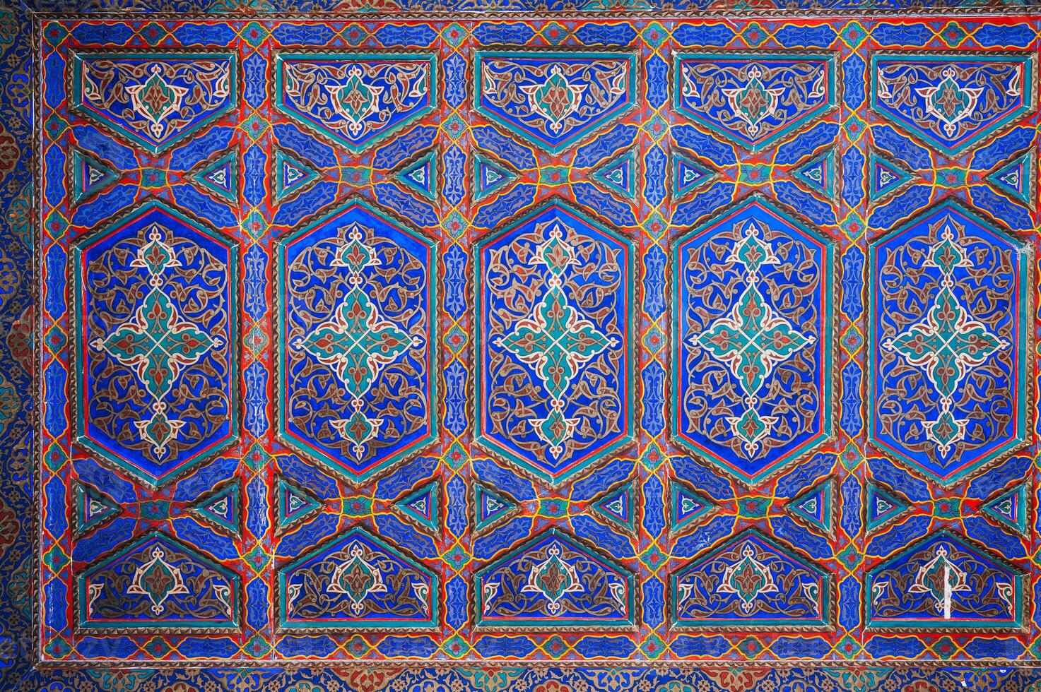 beautiful wooden painted ceiling in Museum of Art of Uzbekistan with traditional Uzbek ornaments and colorful oriental patterns in Tashkent photo