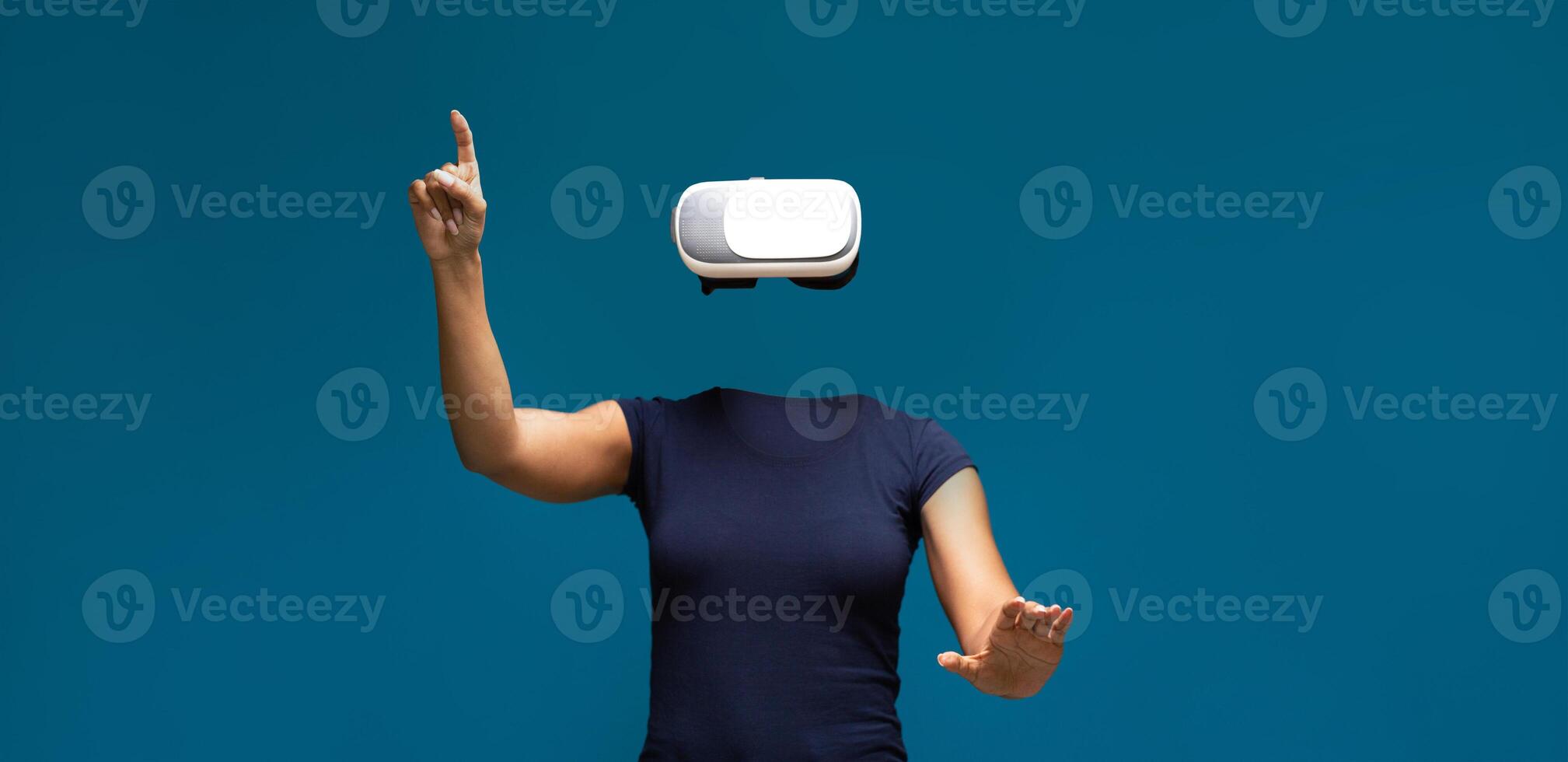 A user is experiencing virtual reality with a headset, engaging in an interactive activity. The focus is on the technology, highlighting a seamless blend of innovation and experience. photo