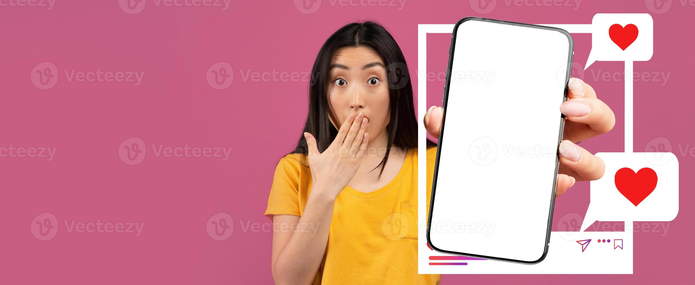 A young influencer holds a smartphone displaying a blank screen while expressing surprise. The vibrant background and heart symbols highlight her engagement with online interactions and messages. photo