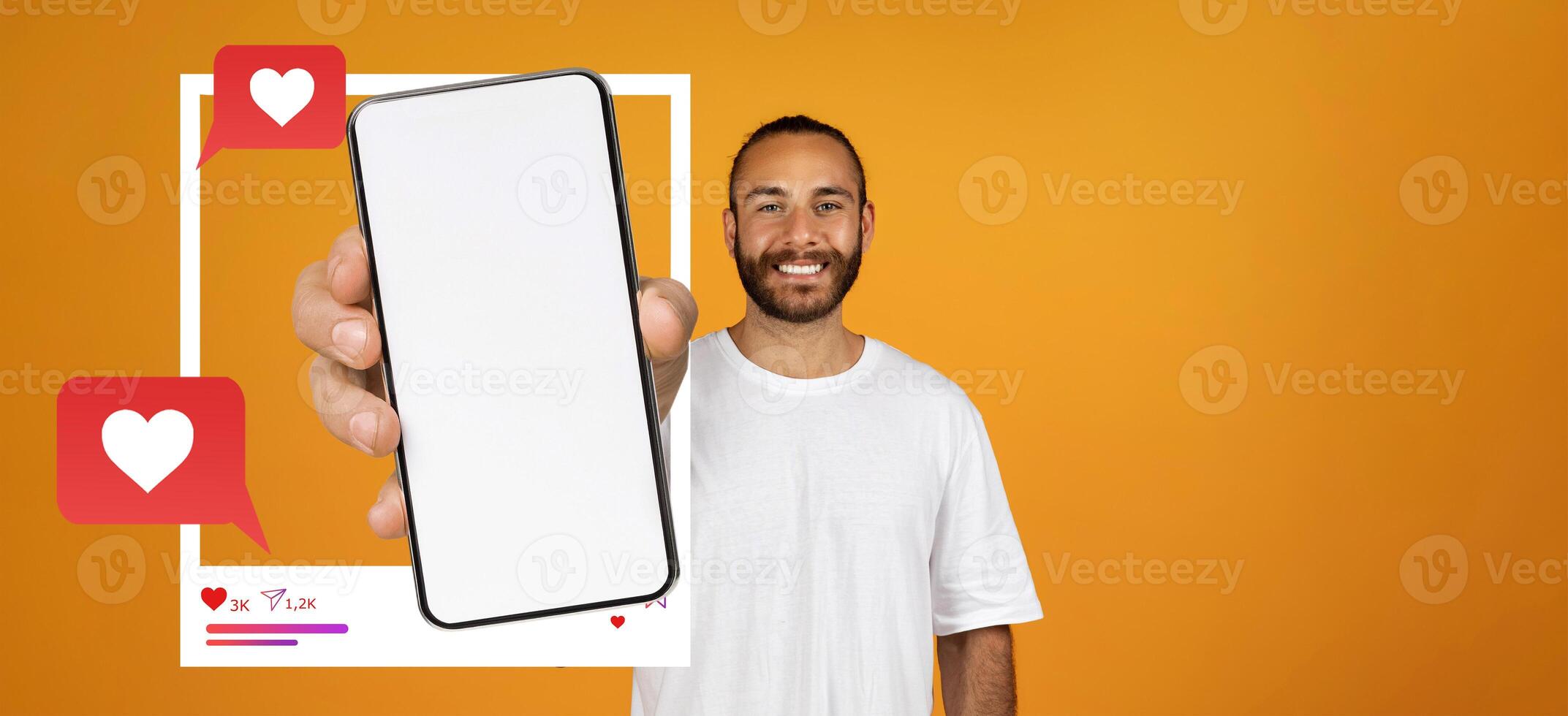 A person stands against an orange background, holding a smartphone with a blank screen. The scene highlights social media elements like likes and chat messages, reflecting online interaction. photo