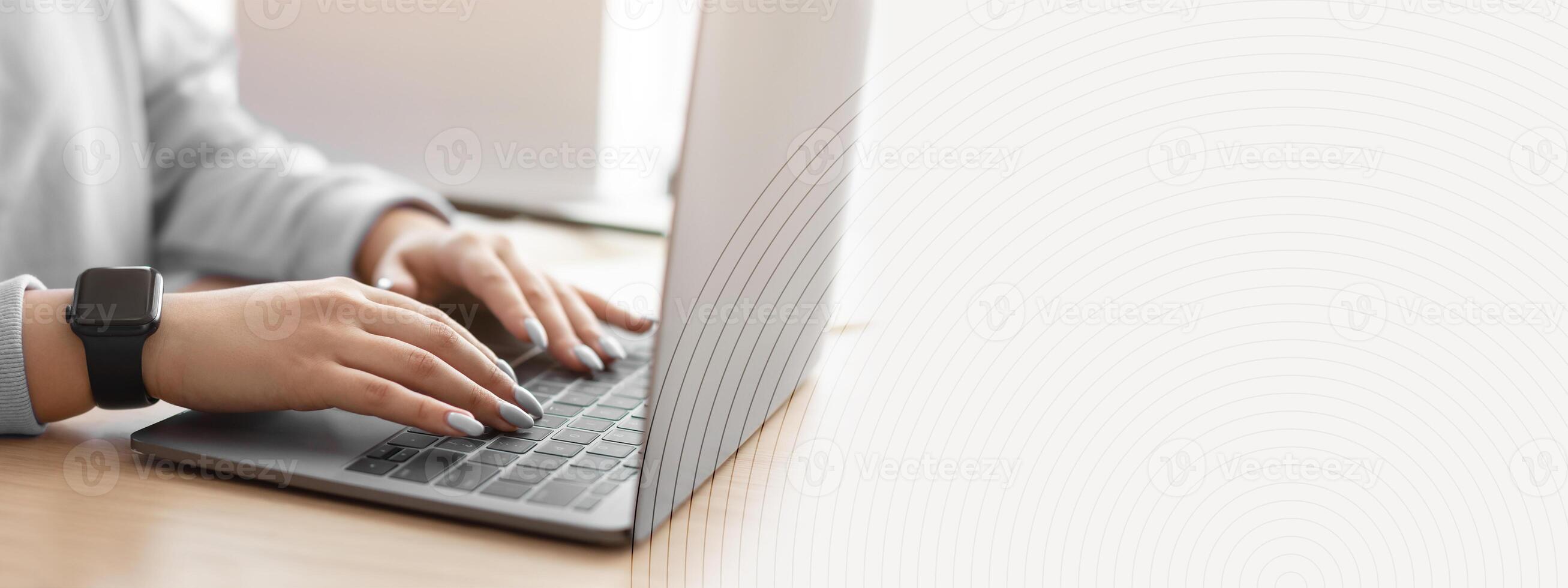 Telecommuting And Freelance Concept. Closeup cropped view of unrecognizable woman using computer, typing on laptop keyboard, writing report, sitting at desk, selective focus. People And Technology photo