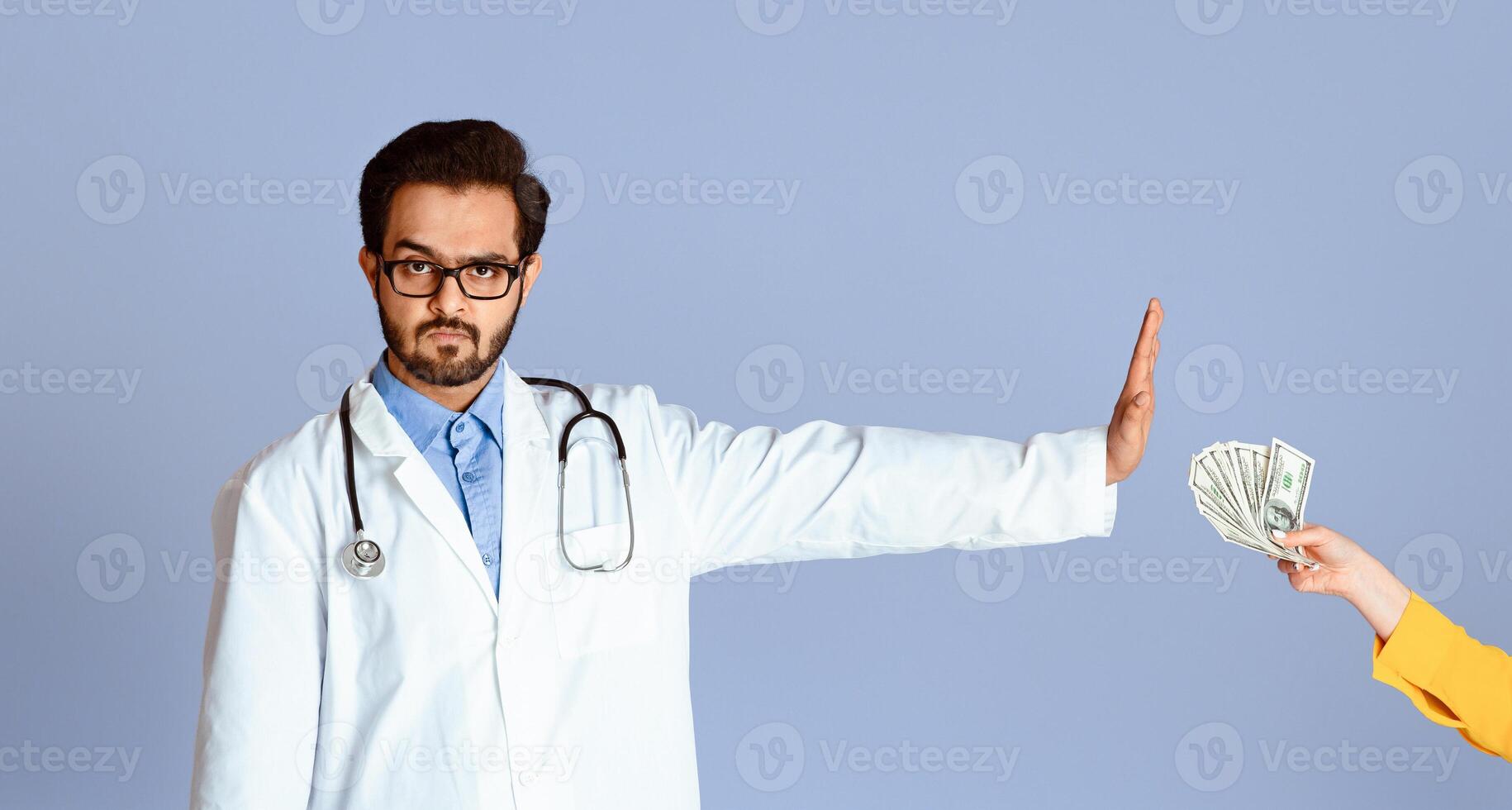 No to corruption concept. Serious Indian doctor refusing bribe from female patient on lilac background, panorama photo