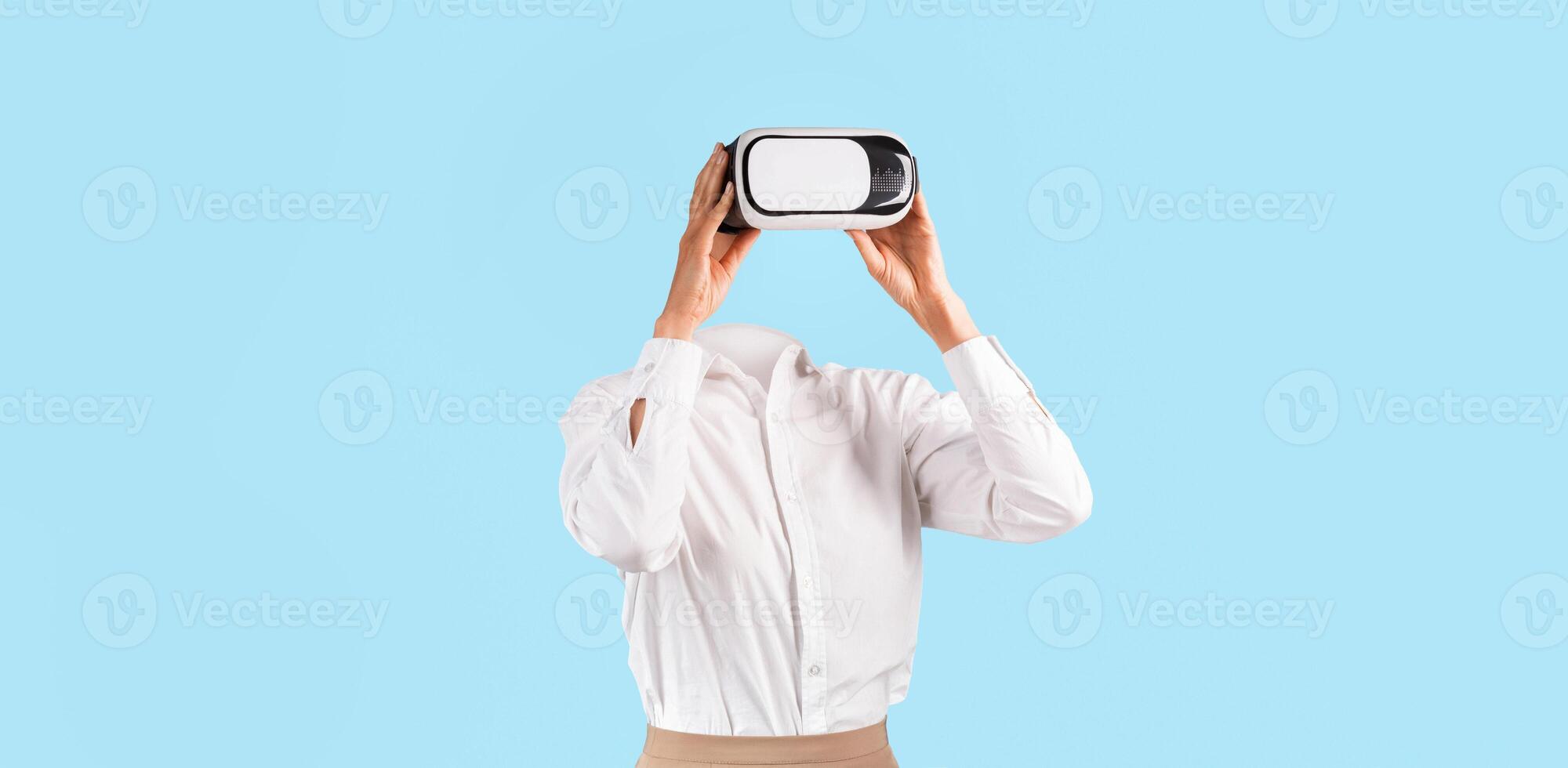 A user engages with a virtual reality headset, experiencing technology without visible identity. They are in a simple, isolated environment, emphasizing the gadget's modern appeal. photo