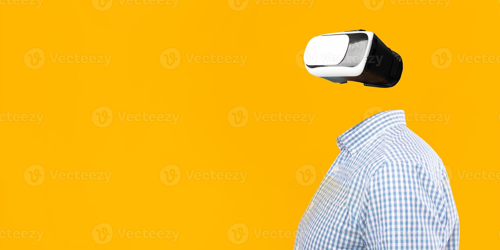 A user interacts with a virtual reality headset, fully engaged in a tech experience. The absence of a head adds a surreal feel against a vibrant yellow background, showcasing modern gadgetry. photo