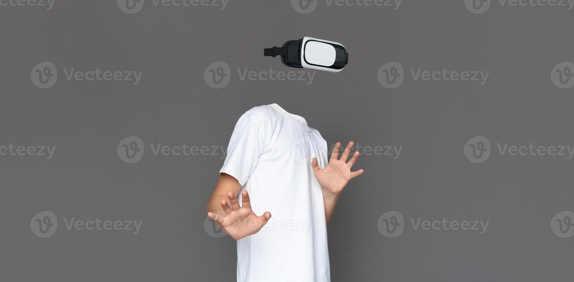 A user engages with a virtual reality headset, immersed in modern technology and experiencing augmented reality. The background is simple, enhancing focus on the gadget. photo
