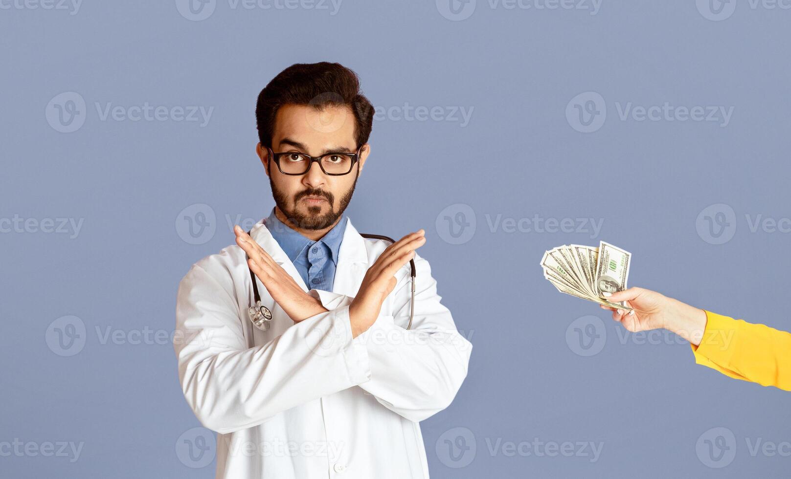 No to corruption concept. Indian medical specialist refusing bribe from patient over lilac background. Panorama photo