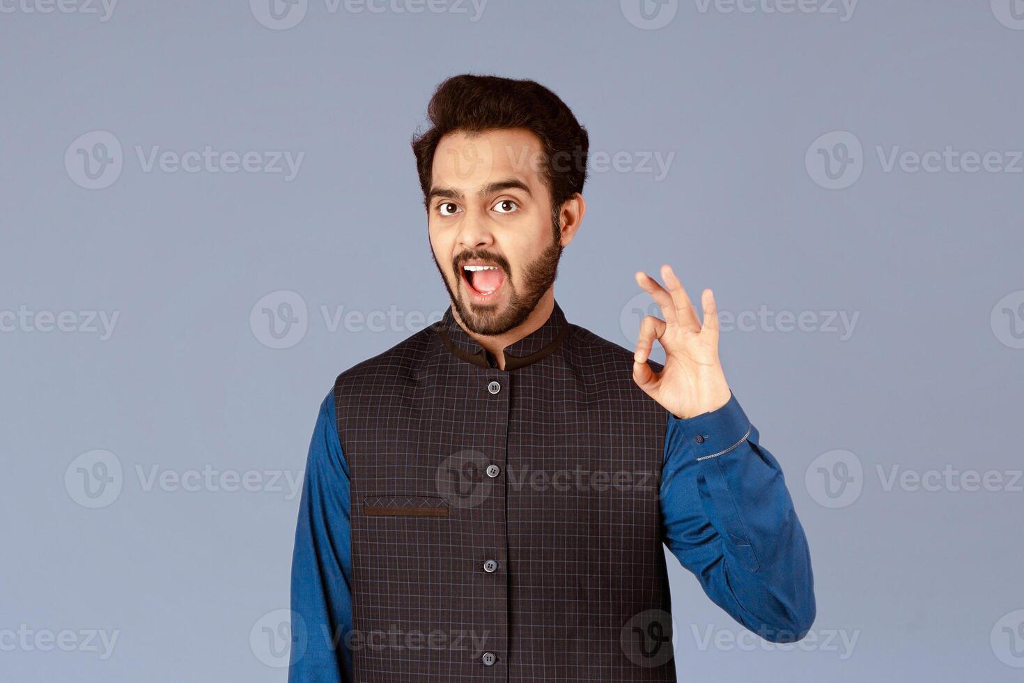 Expressing positivity. Happy Indian guy showing okay gesture over lilac background, panorama photo