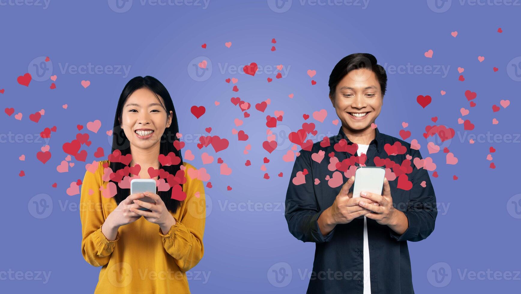 A couple stands smiling as they exchange affectionate messages on their smartphones, surrounded by floating heart icons. They celebrate their love on Valentine's Day in a joyful, isolated collage. photo