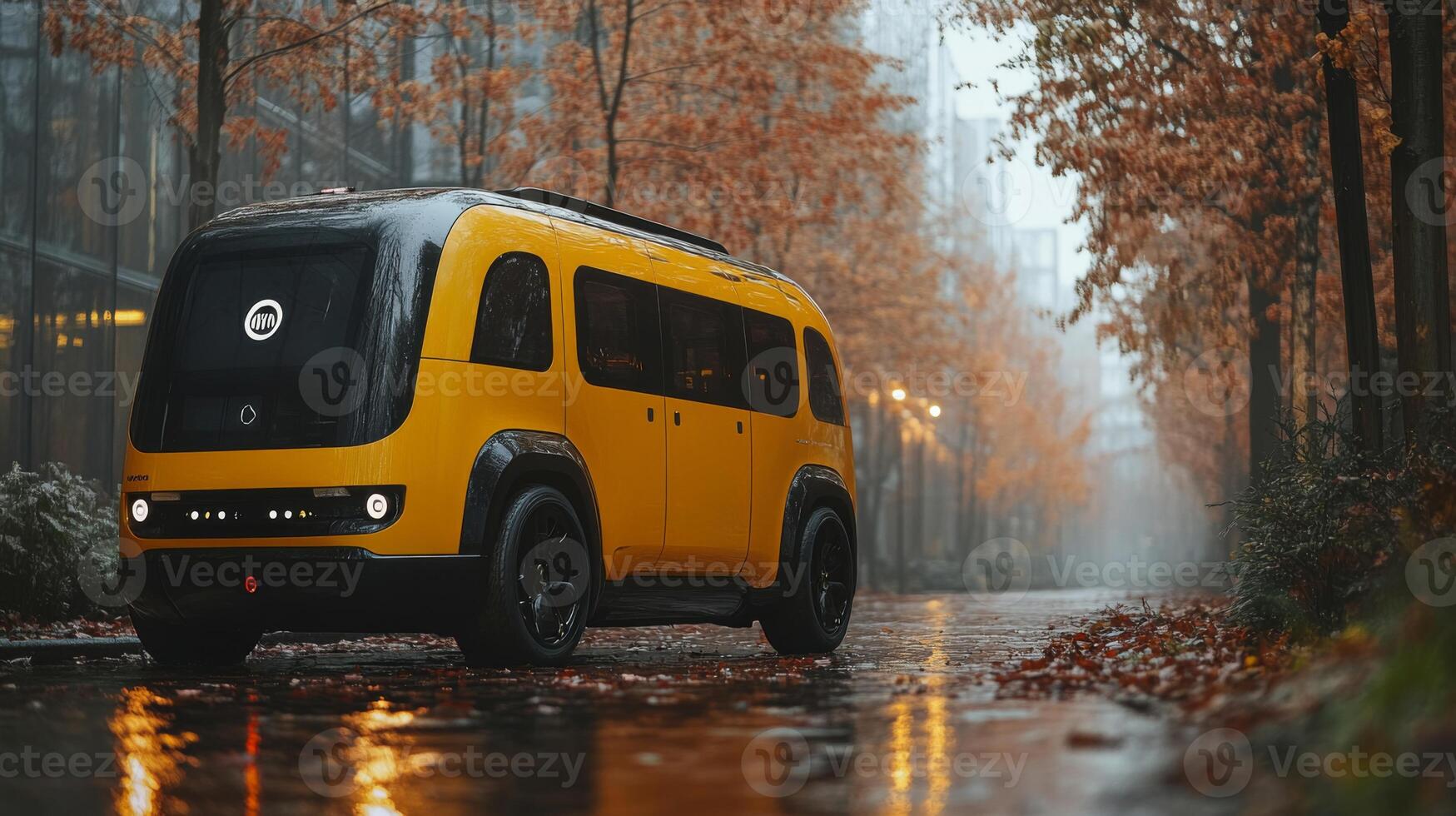 An advanced autonomous delivery vehicle operates along a wet city street lined with trees displaying autumn foliage, signaling a shift towards automated transportation solutions. photo