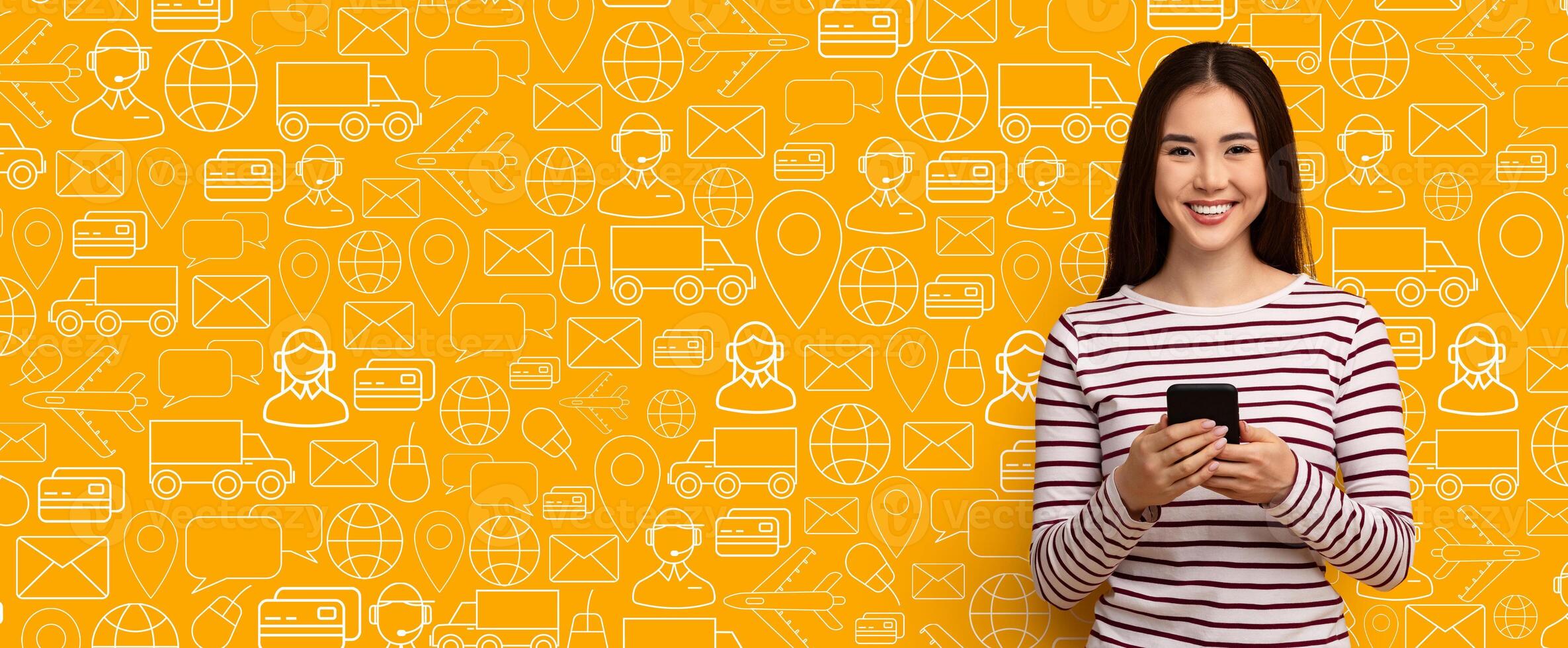 A smiling customer interacts with a delivery service application on her smartphone against a vibrant yellow background filled with relevant icons. She enjoys the convenience of online shopping. photo