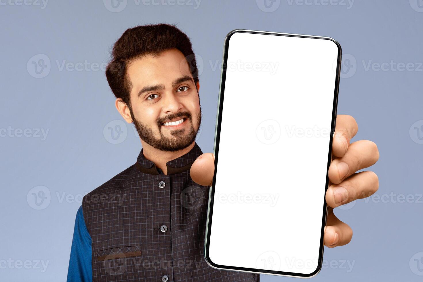 Expressing positivity. Smiling Indian guy showing thumb up gesture over violet background photo