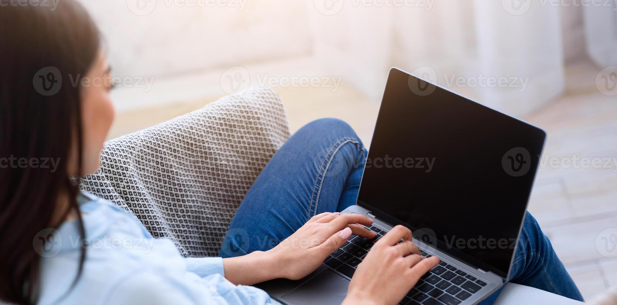 Mockup image of asian girl using laptop computer with blank screen at home, space for your design photo