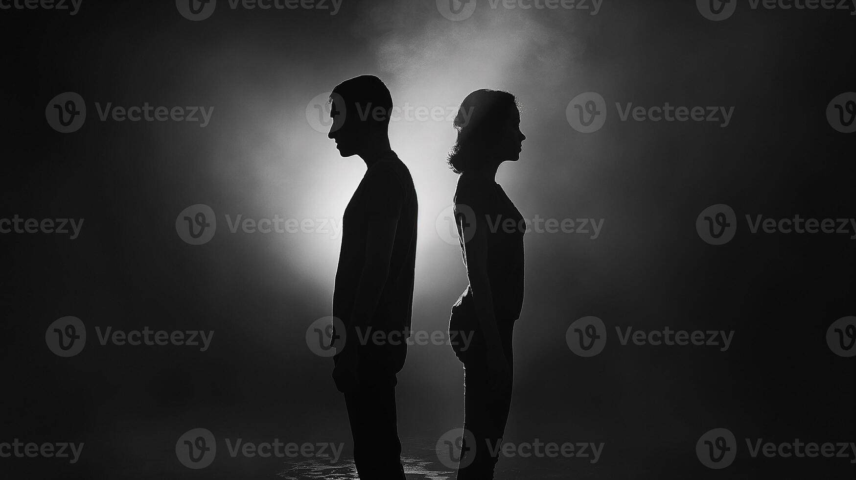 This Two people stand back to back, symbolizing conflict and tension in search of resolution. photo
