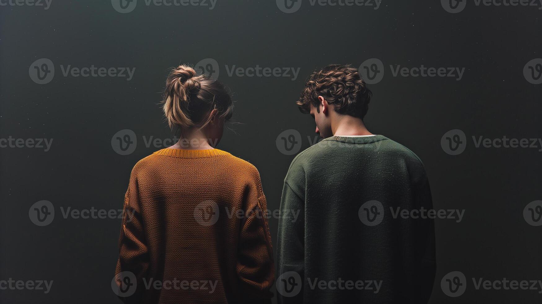 This Two people stand back to back, embodying tension and disagreement while seeking understanding. photo
