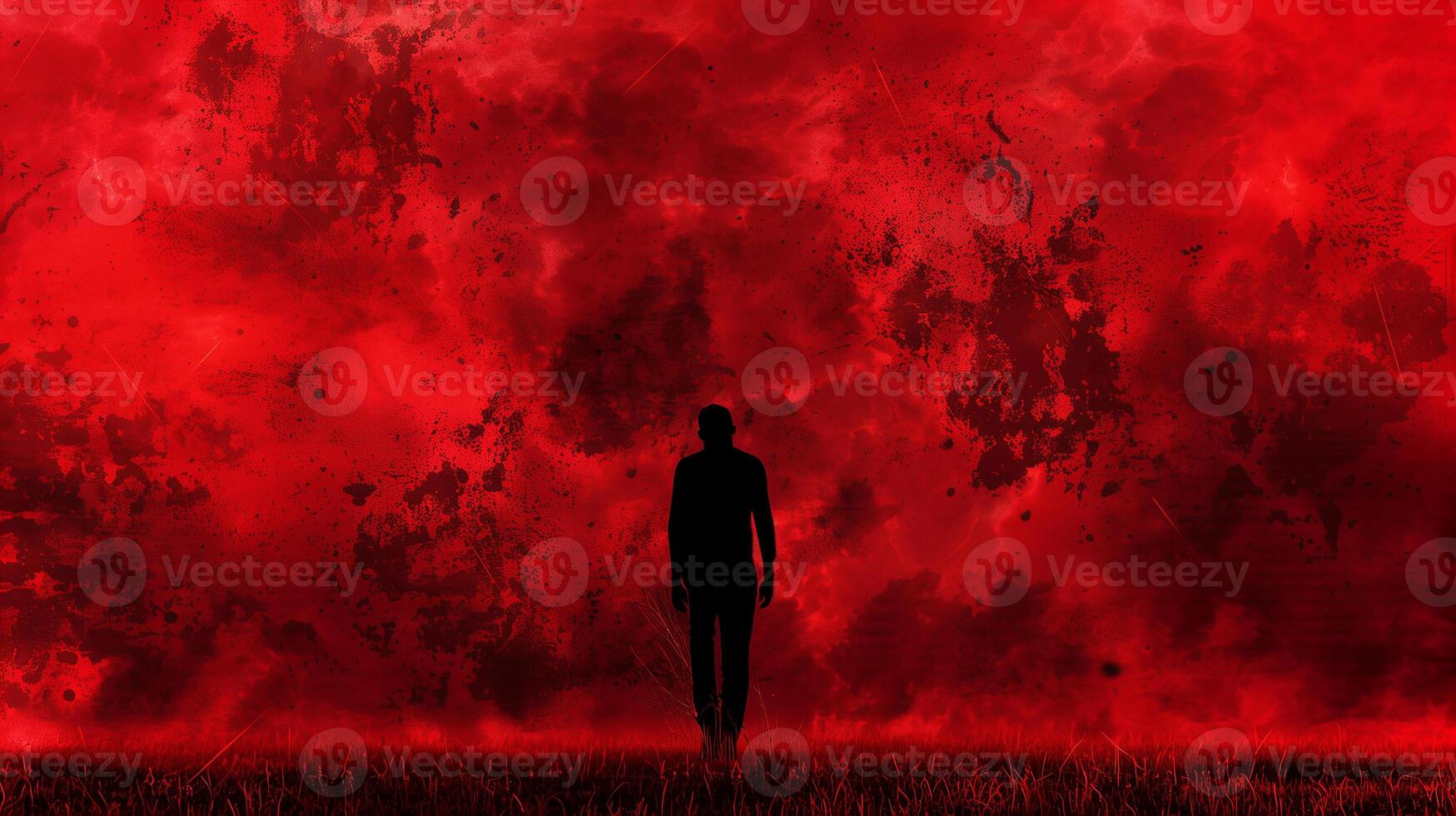 This A figure stands alone in a field, with a dramatic red background hinting at turmoil. photo