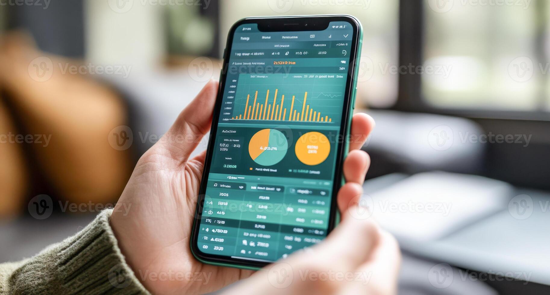 A person holding a smartphone displaying an interactive banking app. The screen shows transaction graphs, balance information, and account statements in a modern indoor setting. photo