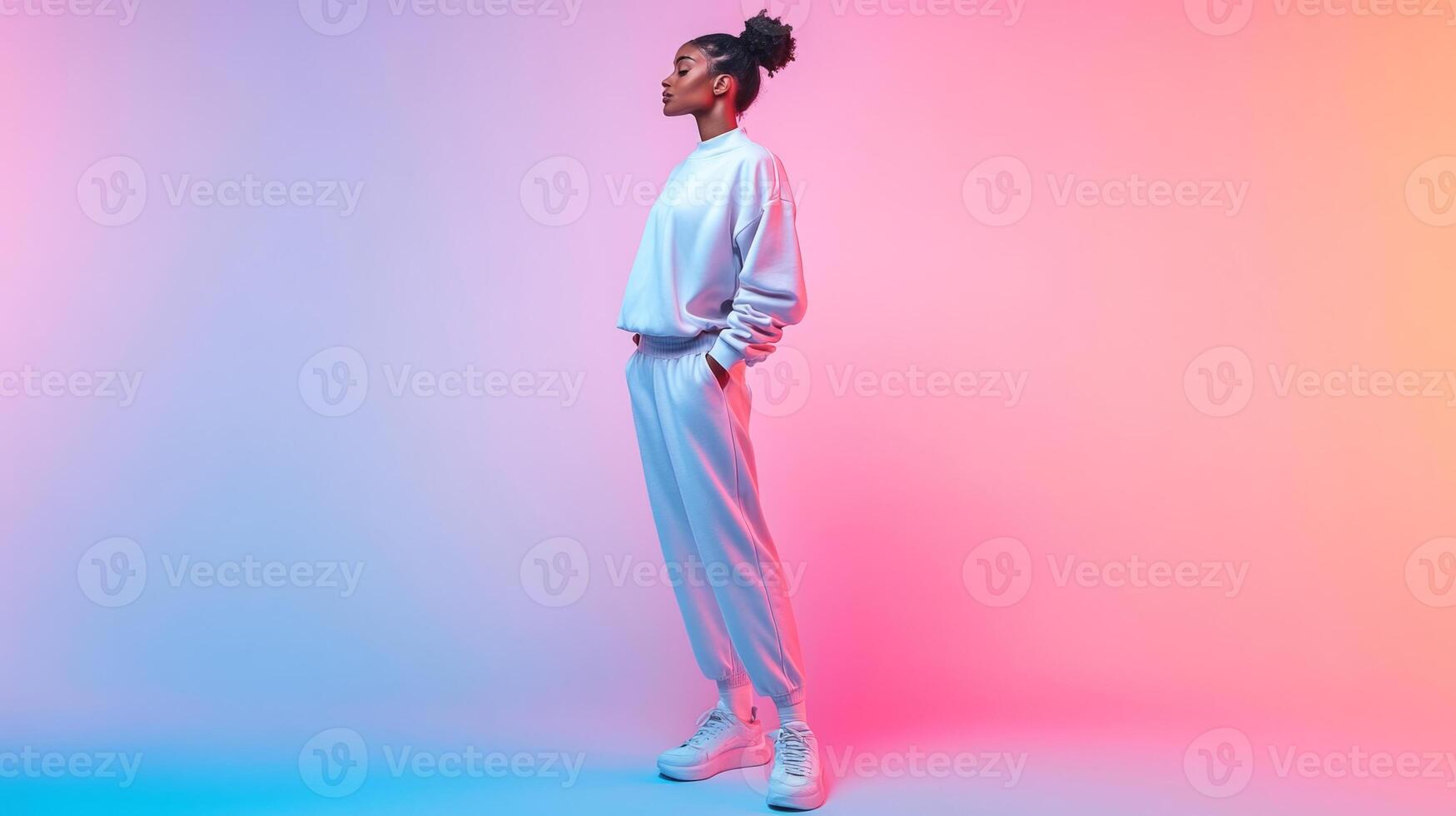 A confident woman stands tall in a comfortable outfit, showcasing her style and sportswear. The pastel background enhances the vibrant look, creating a trendy atmosphere for her pose. photo