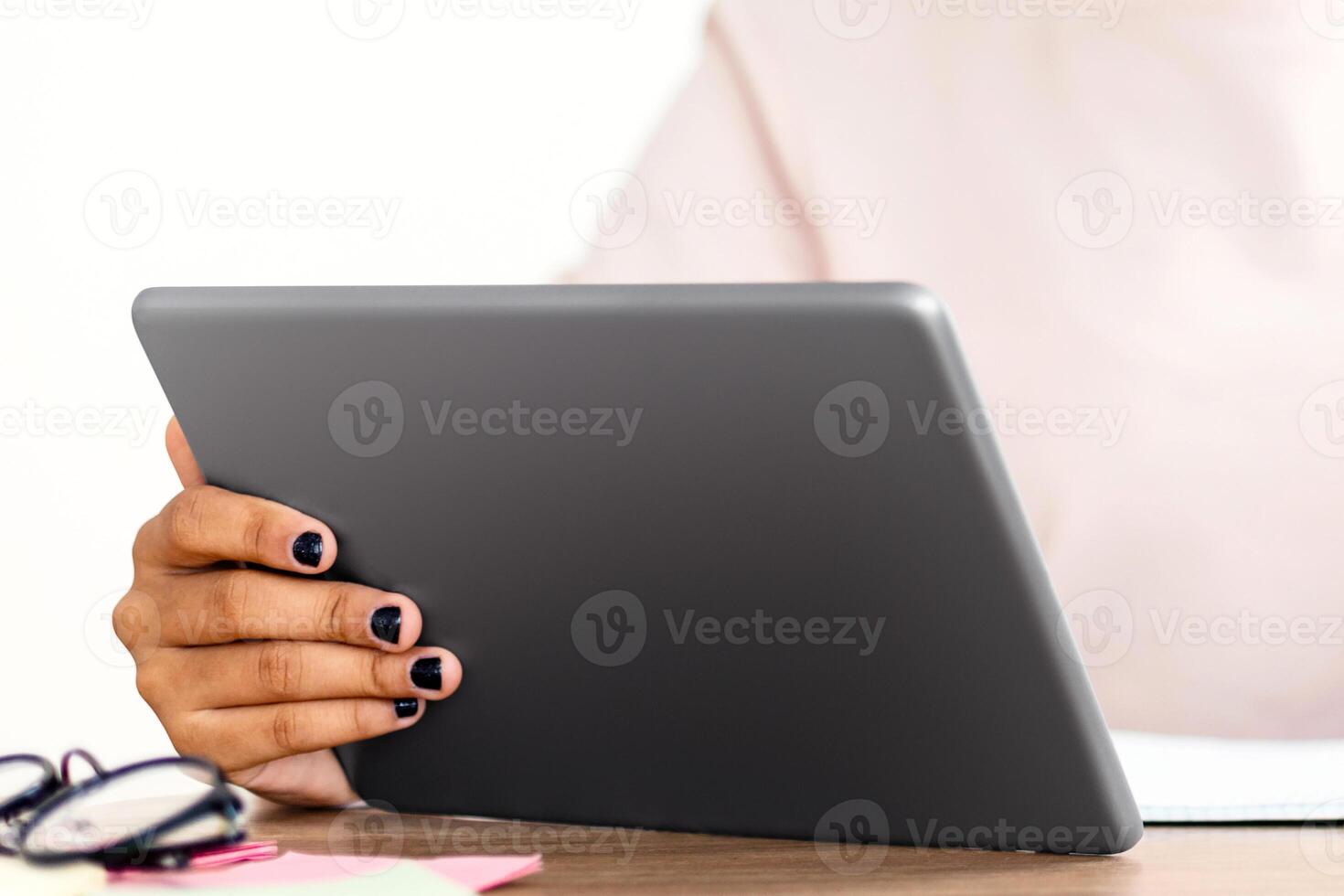Black Schoolgirl In Surgical Mask Using Digital Tablet In Classroom, Looking Out Of Window. School Education During Pandemic. Shallow Depth photo