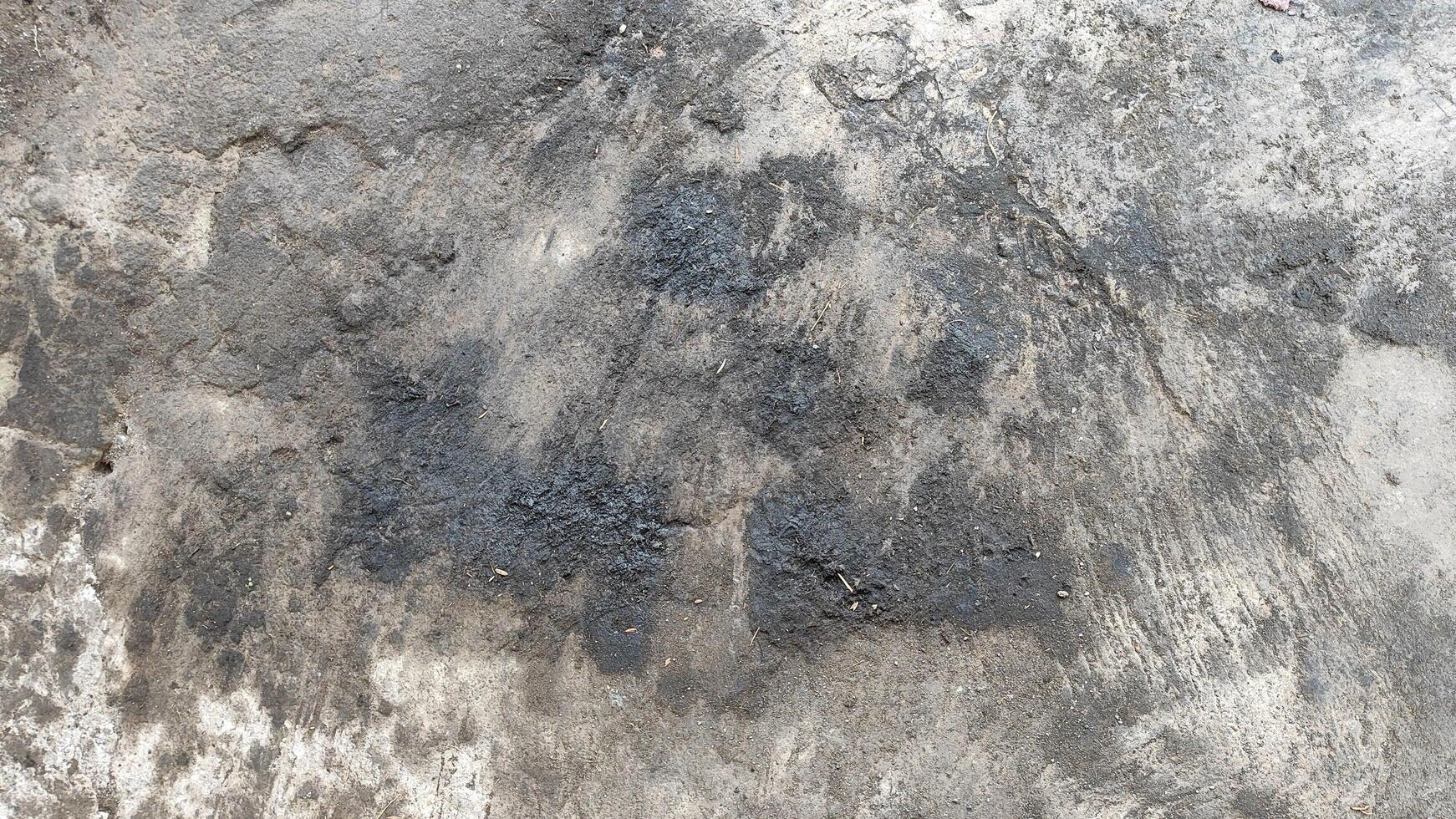 a close up of a dirty concrete wall photo